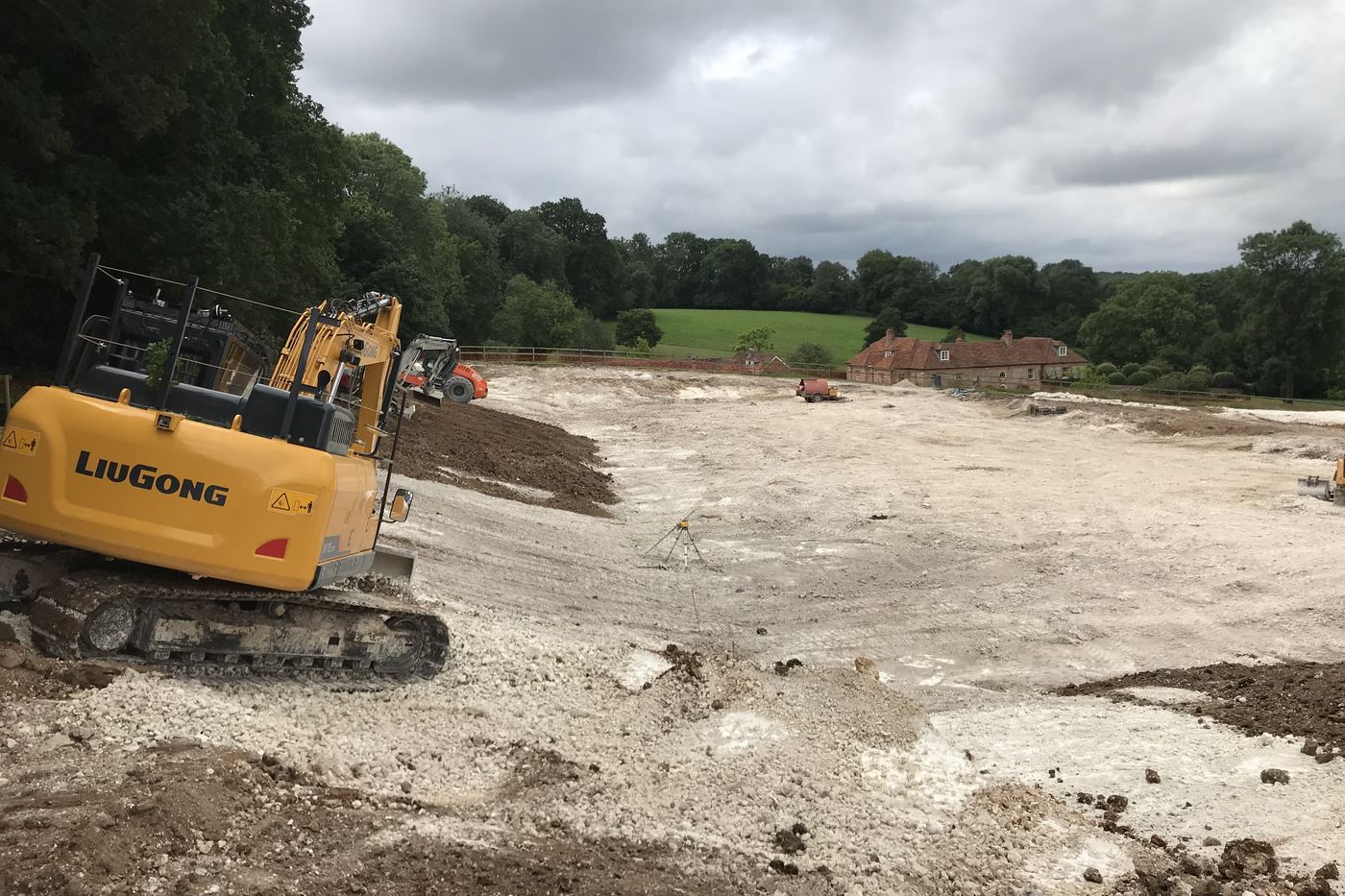 Tracked excavator on a large chalk site strip and bulk earthworks job