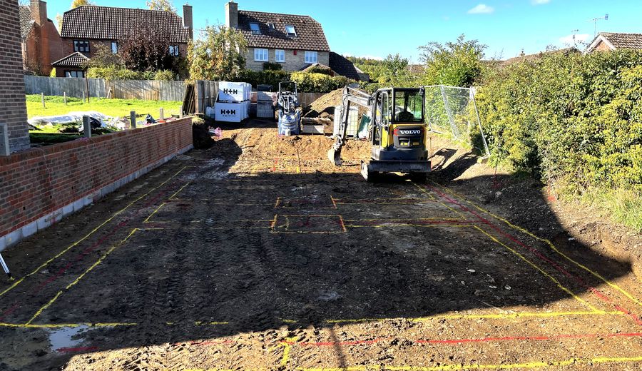 Formation set out and dug to the drawing behind a new retaining wall