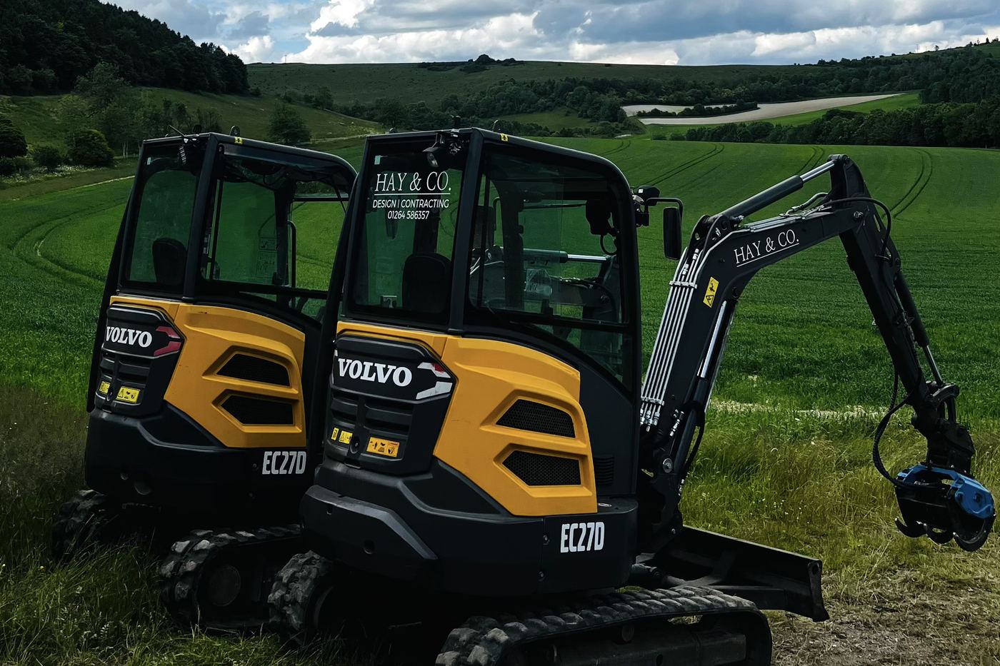 Two Volvo EC27D 3-tonne excavators with Hay and Co livery on a Hampshire downland job